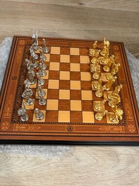 Metallic Gold & Silver Chess Set on Wooden Board